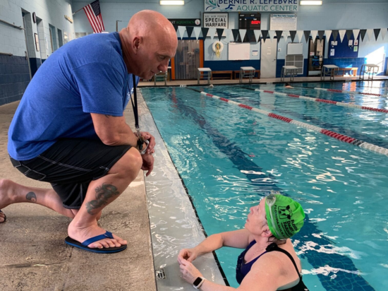 Triathlon couch giving advice to student